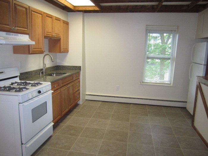 Updated kitchen with granite countertops at 28 Lancaster St #3L